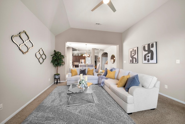334 Hawthorn Dr, Fate, TX 75087 - carpeted living room featuring ceiling fan, baseboards, lofted ceiling, a chandelier, and arched walkways