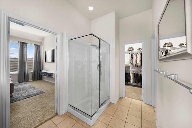 334 Hawthorn Dr, Fate, TX 75087 - full bath with a stall shower, tile patterned flooring, a spacious closet, and baseboards