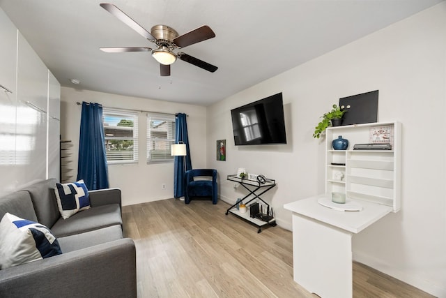 5003 Skillman St Unit 109A, Dallas, TX 75206 - living room featuring light wood-type flooring, a ceiling fan, and baseboards