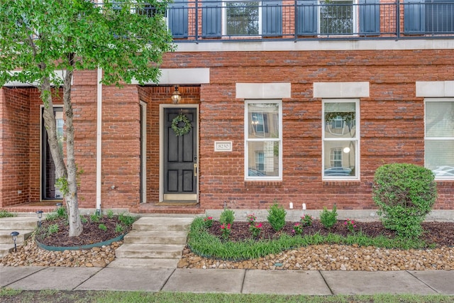 8250 Library St, Frisco, TX 75034 - entrance to property with a balcony and brick siding