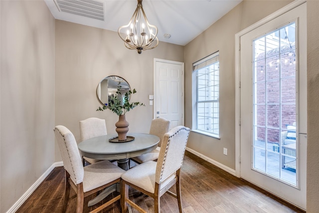 8250 Library St, Frisco, TX 75034 - dining room featuring wood finished floors, a chandelier, and baseboards