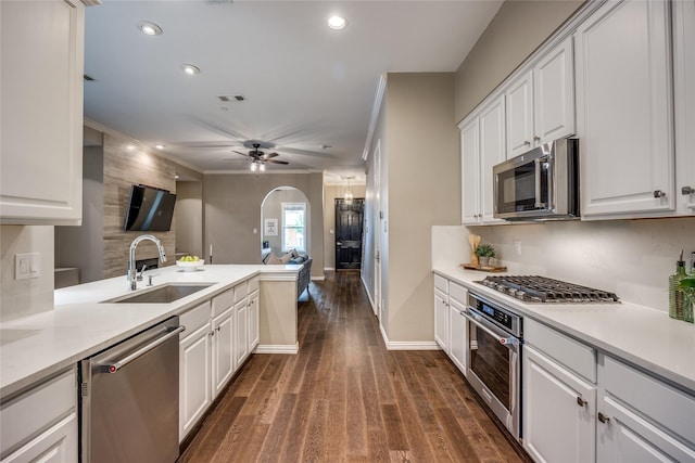8250 Library St, Frisco, TX 75034 - kitchen with appliances with stainless steel finishes, a sink, open floor plan, white cabinetry, and recessed lighting