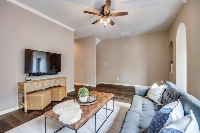 8250 Library St, Frisco, TX 75034 - living area featuring arched walkways, wood finished floors, ceiling fan, and baseboards