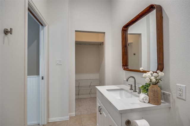 8250 Library St, Frisco, TX 75034 - bathroom featuring vanity, tile patterned flooring, and baseboards