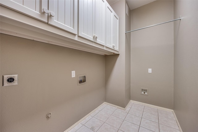 8250 Library St, Frisco, TX 75034 - laundry room with hookup for an electric dryer, cabinet space, washer hookup, tile patterned floors, and baseboards