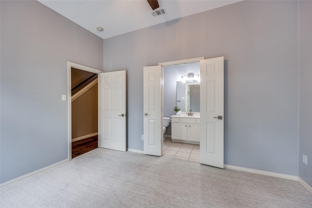 8250 Library St, Frisco, TX 75034 - unfurnished bedroom with light colored carpet, ensuite bathroom, and baseboards
