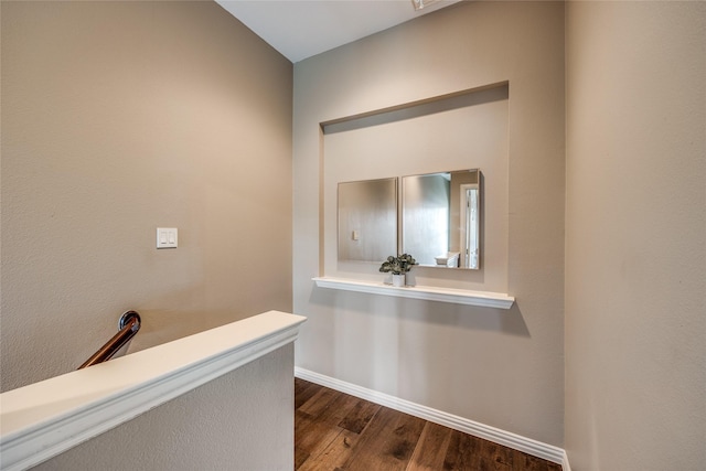 8250 Library St, Frisco, TX 75034 - hall with dark wood-style floors and baseboards
