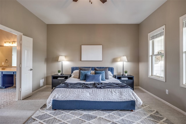 8250 Library St, Frisco, TX 75034 - bedroom featuring light carpet, ensuite bath, baseboards, and ceiling fan
