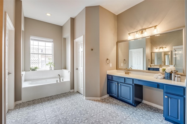 8250 Library St, Frisco, TX 75034 - full bath with vanity, a bath, and baseboards