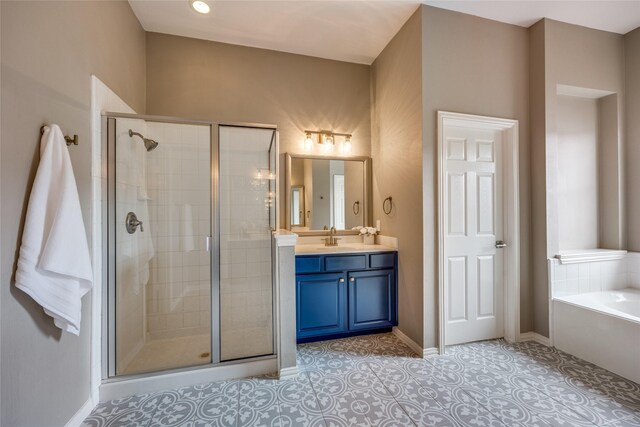 8250 Library St, Frisco, TX 75034 - bathroom with vanity, a shower stall, a bath, and baseboards