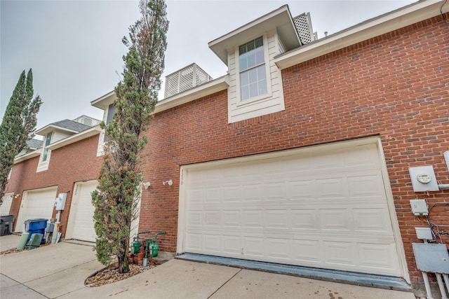 8250 Library St, Frisco, TX 75034 - view of front facade with brick siding and a garage