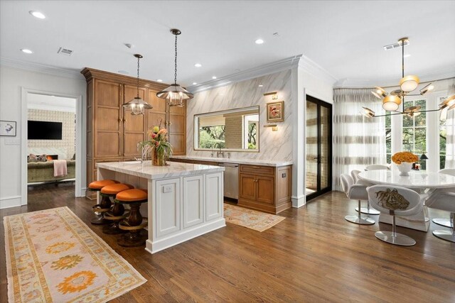 1128 Shady Oaks Ln, Westover Hills, TX 76107 - kitchen with stainless steel dishwasher, brown cabinets, a chandelier, crown molding, and dark wood-style flooring