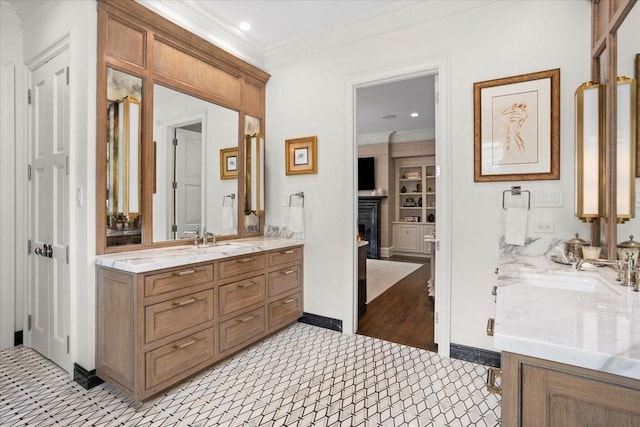 1128 Shady Oaks Ln, Westover Hills, TX 76107 - bathroom with vanity, crown molding, a lit fireplace, and recessed lighting