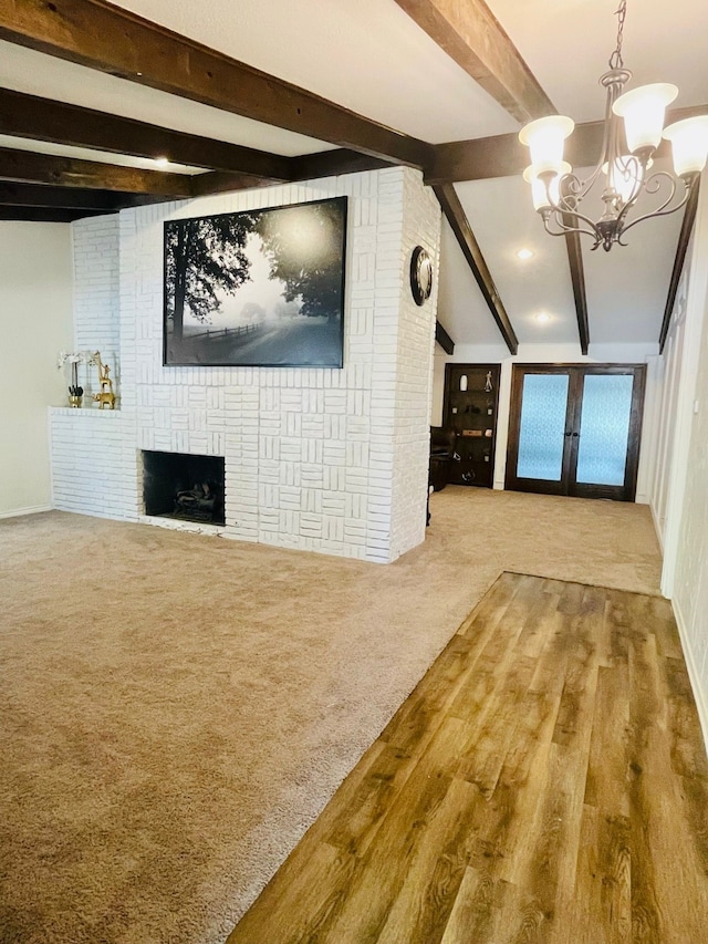 2605 Twinpost Ct, Irving, TX 75062 - unfurnished living room with beamed ceiling, a chandelier, a fireplace, and wood finished floors