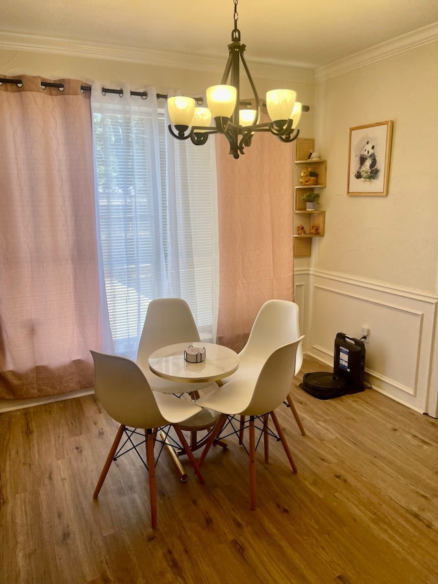 2605 Twinpost Ct, Irving, TX 75062 - dining area with a chandelier, wood finished floors, and ornamental molding