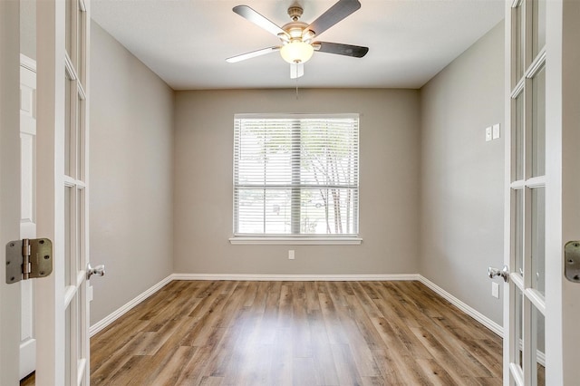 430 Mitchell Blvd, Weatherford, TX 76087 - spare room featuring light wood-style floors, ceiling fan, and baseboards