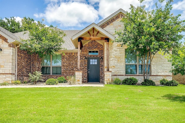 430 Mitchell Blvd, Weatherford, TX 76087 - view of front of house featuring stone siding, a front lawn, a shingled roof, and brick siding