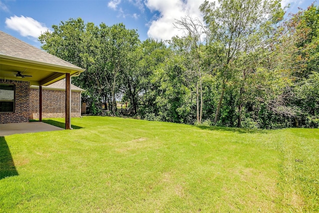 430 Mitchell Blvd, Weatherford, TX 76087 - view of green lawn with a ceiling fan and a patio area