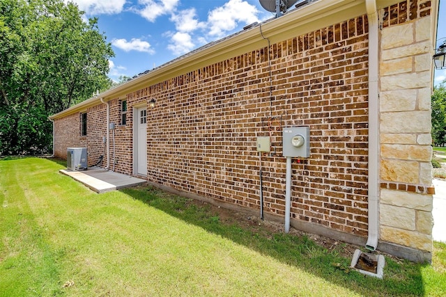 430 Mitchell Blvd, Weatherford, TX 76087 - view of property exterior with brick siding, a lawn, and cooling unit