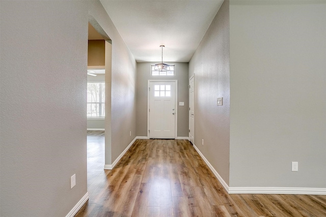 430 Mitchell Blvd, Weatherford, TX 76087 - entryway featuring wood finished floors, baseboards, and a textured wall