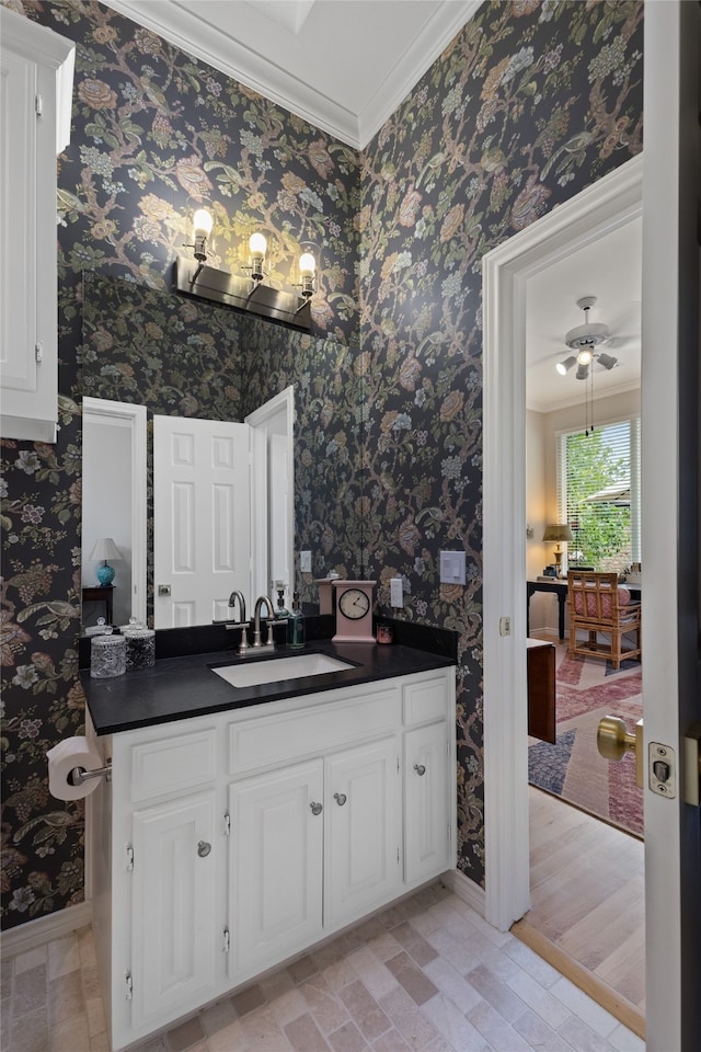 6518 Laurel Valley Rd, Dallas, TX 75248 - bathroom with crown molding, baseboards, vanity, wallpapered walls, and ceiling fan