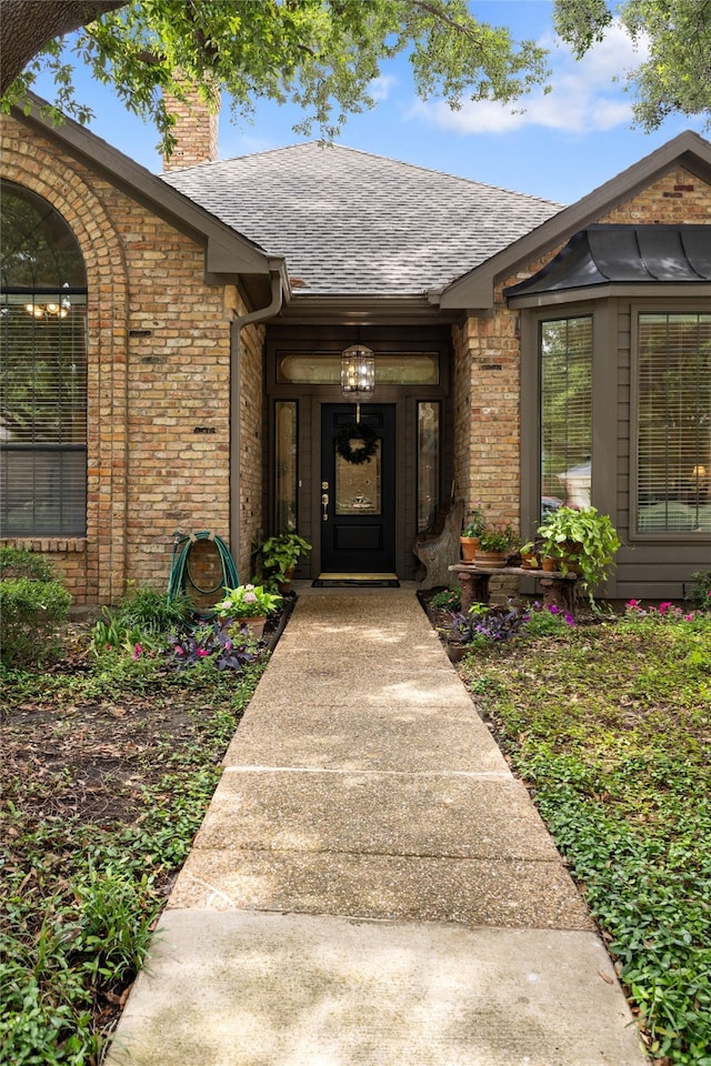 6518 Laurel Valley Rd, Dallas, TX 75248 - property entrance featuring brick siding, a chimney, and a shingled roof