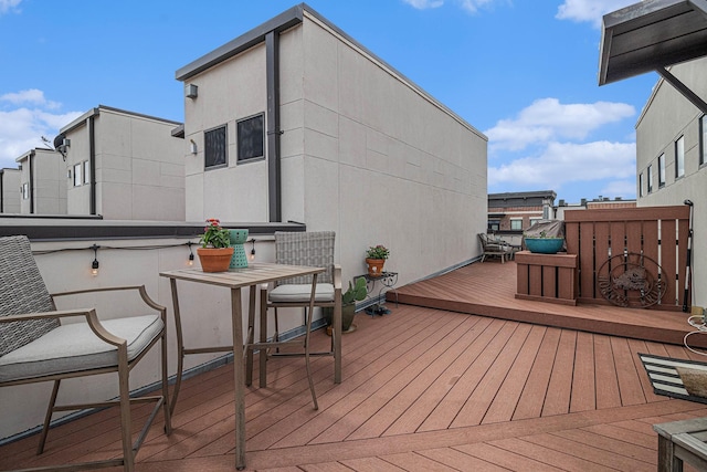724 E Bluff St, Fort Worth, TX 76102 - wooden deck with outdoor dining space