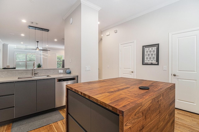 724 E Bluff St, Fort Worth, TX 76102 - kitchen featuring a sink, stainless steel dishwasher, light wood-style floors, butcher block countertops, and gray cabinetry