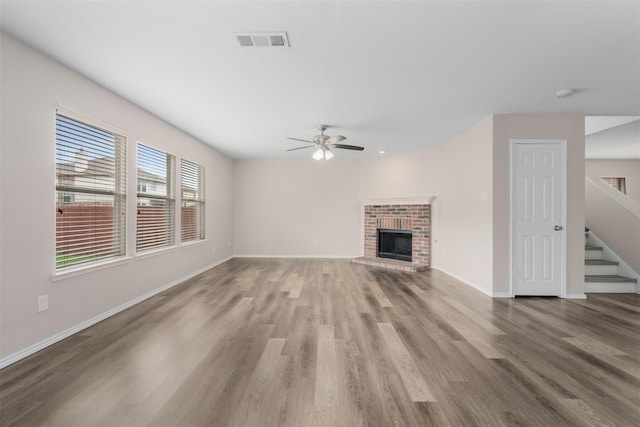 13140 Fencerow Rd, Fort Worth, TX 76244 - unfurnished living room with wood finished floors, ceiling fan, stairway, and baseboards