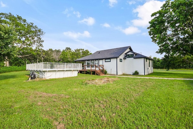2415 Vz County Road 2624, Wills Point, TX 75169 - back of house featuring a wooden deck, an outdoor pool, and a yard