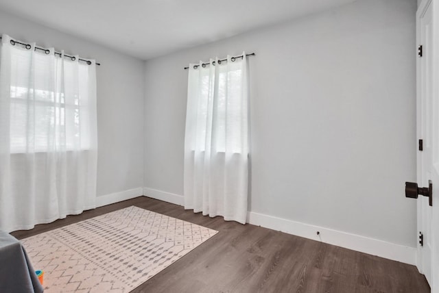 2415 Vz County Road 2624, Wills Point, TX 75169 - spare room featuring baseboards and dark wood-style floors
