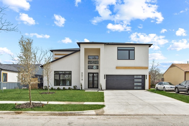 9974 Witham St, Dallas, TX 75220 - modern home with stucco siding, a garage, a front yard, and concrete driveway