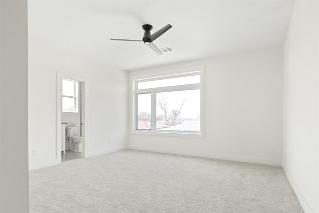 9974 Witham St, Dallas, TX 75220 - unfurnished bedroom with light carpet, baseboards, ensuite bath, and ceiling fan