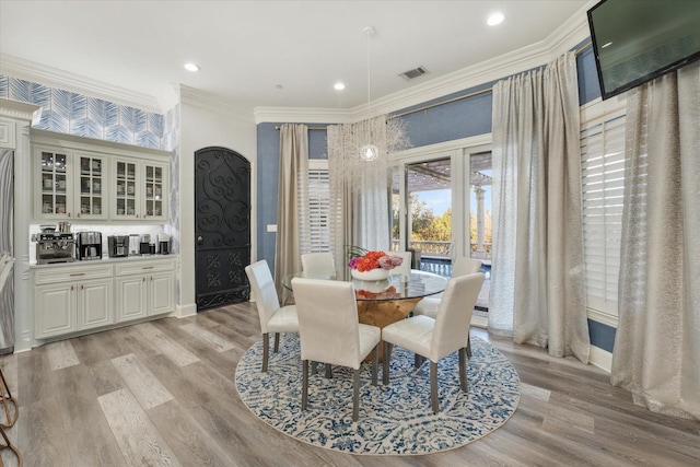 1705 Bison Meadow Ln, Heath, TX 75032 - dining area with ornamental molding, light wood-style floors, baseboards, and recessed lighting