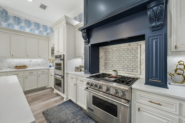 1705 Bison Meadow Ln, Heath, TX 75032 - kitchen with stainless steel appliances, tasteful backsplash, light countertops, white cabinetry, and ornamental molding