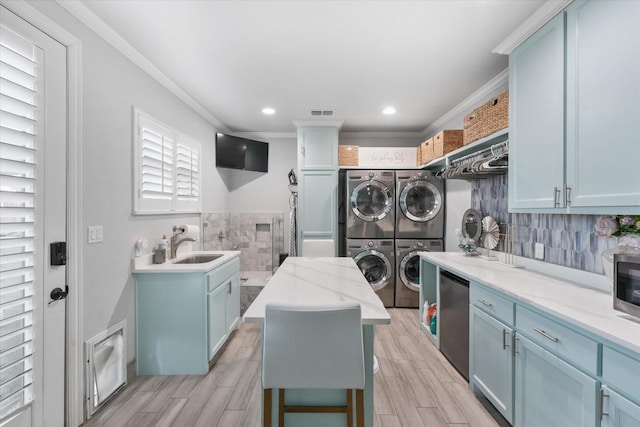 1705 Bison Meadow Ln, Heath, TX 75032 - washroom with stacked washer / drying machine, crown molding, light wood finished floors, recessed lighting, and independent washer and dryer