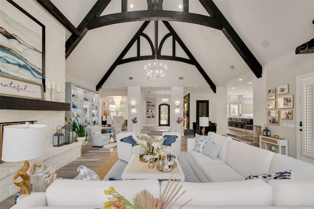 1705 Bison Meadow Ln, Heath, TX 75032 - living area with a chandelier, high vaulted ceiling, beamed ceiling, wood finished floors, and plenty of natural light