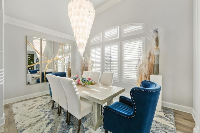 1705 Bison Meadow Ln, Heath, TX 75032 - dining room with ornamental molding, baseboards, a chandelier, wood finished floors, and vaulted ceiling