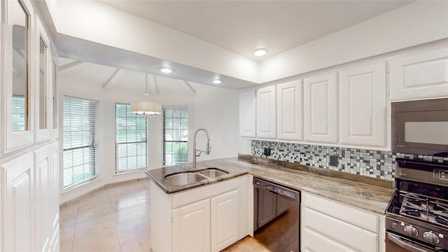 2212 Creekwood Ct, Flower Mound, TX 75028 - kitchen with black appliances, a sink, a peninsula, white cabinetry, and backsplash