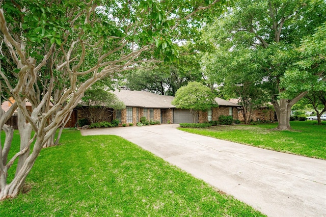 2212 Creekwood Ct, Flower Mound, TX 75028 - view of front of house with an attached garage, driveway, a front yard, and brick siding