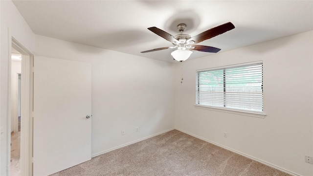 2212 Creekwood Ct, Flower Mound, TX 75028 - empty room with ceiling fan, light carpet, and baseboards