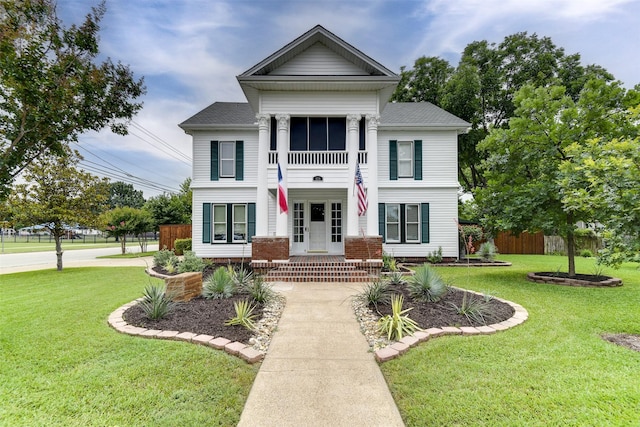 520 N College St, Waxahachie, TX 75165 - greek revival house featuring covered porch and a shingled roof
