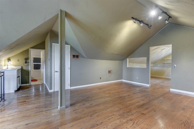 520 N College St, Waxahachie, TX 75165 - bonus room with vaulted ceiling, baseboards, wood finished floors, and a sink