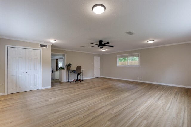 520 N College St, Waxahachie, TX 75165 - unfurnished living room with a ceiling fan, light wood-style flooring, baseboards, and ornamental molding