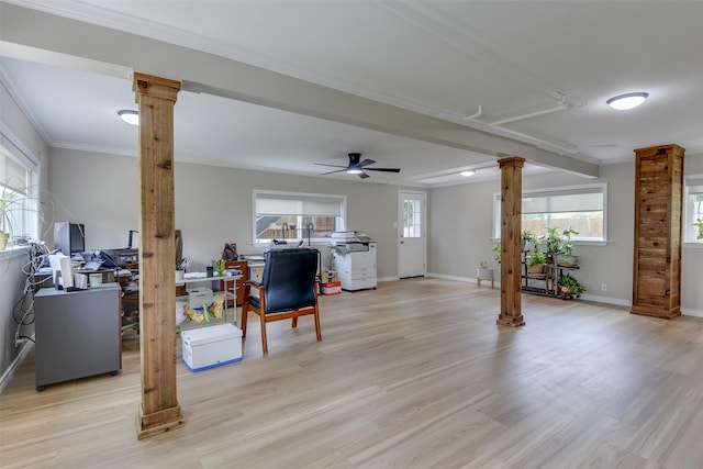 520 N College St, Waxahachie, TX 75165 - living room featuring ornate columns, ornamental molding, light wood finished floors, baseboards, and ceiling fan