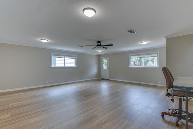 520 N College St, Waxahachie, TX 75165 - unfurnished office with ornamental molding, baseboards, healthy amount of natural light, ceiling fan, and light wood-style flooring