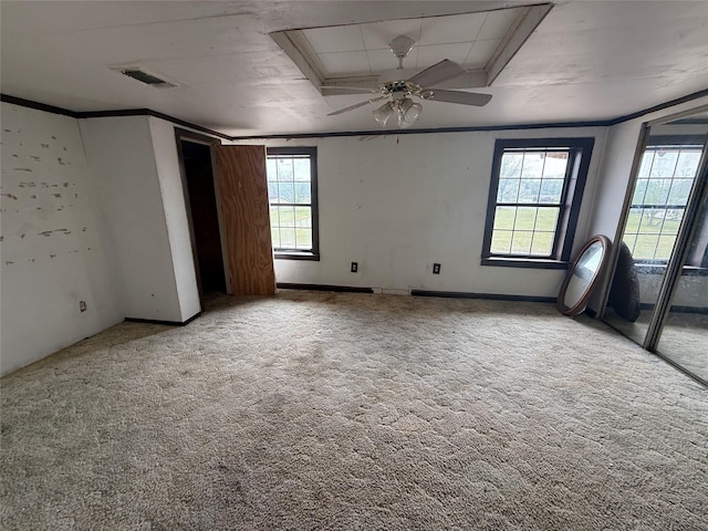 309 E Housley St, Strawn, TX 76475 - spare room with plenty of natural light, light colored carpet, ornamental molding, and a ceiling fan