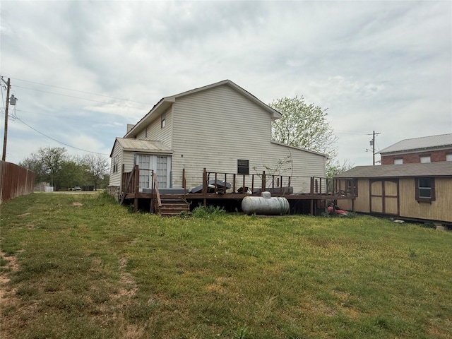 309 E Housley St, Strawn, TX 76475 - back of house with a deck and a lawn