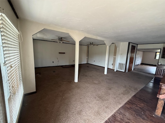 309 E Housley St, Strawn, TX 76475 - unfurnished living room featuring a ceiling fan and baseboards