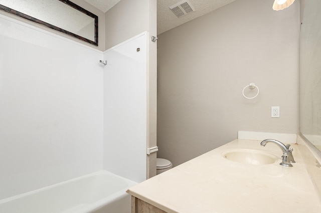 2200 Clover Park Dr, Arlington, TX 76013 - full bathroom featuring vanity, a textured ceiling, and shower / bath combination